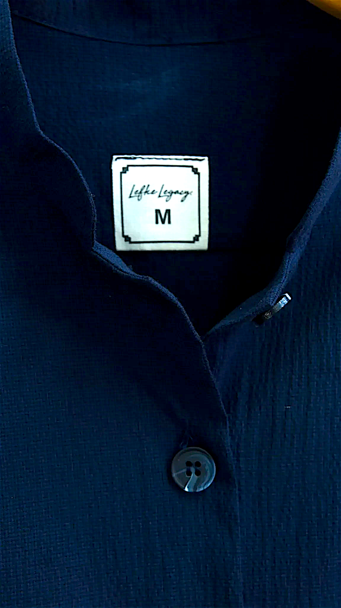 Lefke Legacy navy cotton shirt featuring a mandarin collar and a branded size M label inside the neckline.