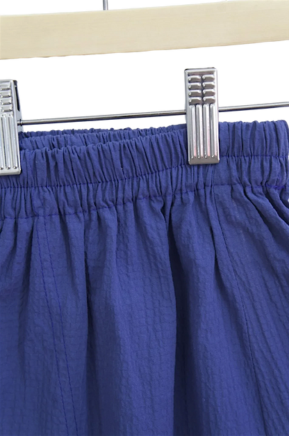 Lefke Legacy indigo cotton shalwar featuring a comfortable elasticated drawstring waist and textured fabric finish.