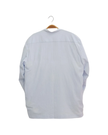 Back view of a Lefke Legacy pale blue cotton mix shirt with a mandarin collar, hanging on a wooden hanger.
